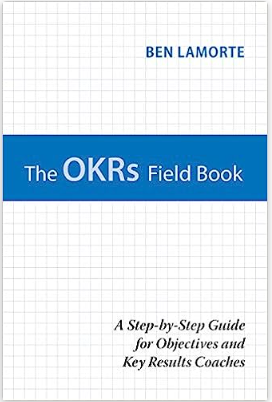 An image of a book cover with horizontal grid lines and a blue rectangular block in the middle